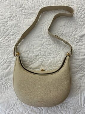 Songmont Cream Pebbled Leather Crescent Shoulder Bag